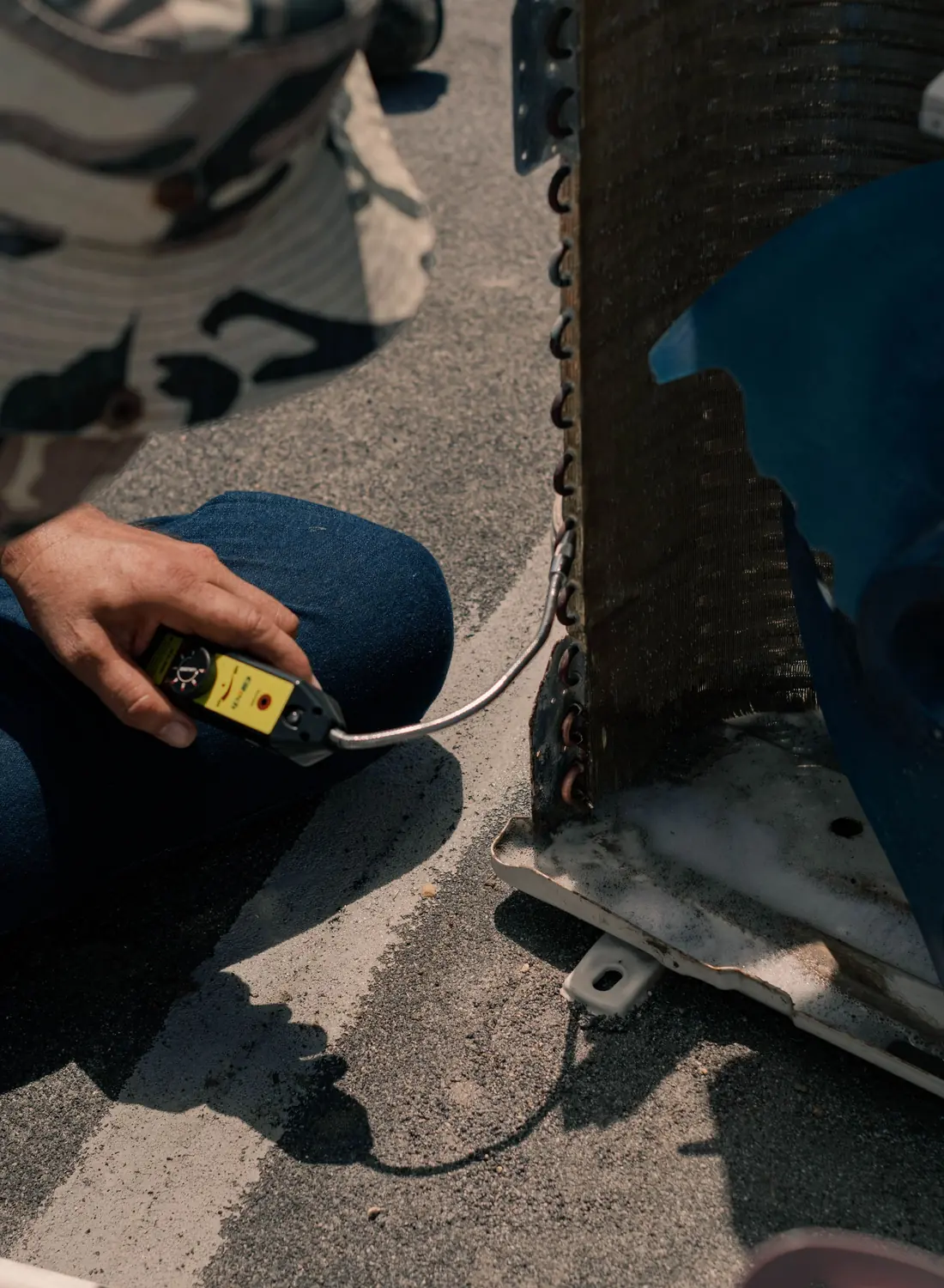 HVAC technician servicing a condenser unit